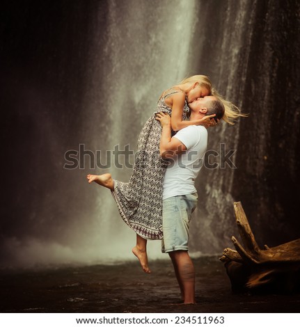 retro revival photo of couple travels to balinese waterfall
