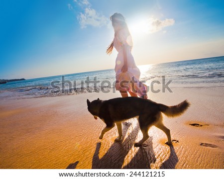 woman traveling with dog near the beach