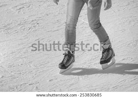 Image of young man who are ice skating at the ice rink outdoors at Medeo