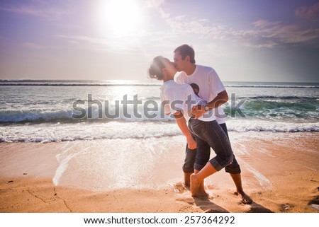 wedding couple just kissing at blue beach