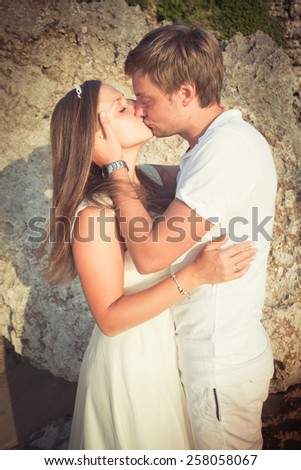 wedding couple just kissing at Balinese beach