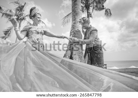 Wedding ceremony of mature couple dressed in Balinese costume