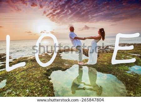 wedding couple just married at Hawaii near the beach with love text