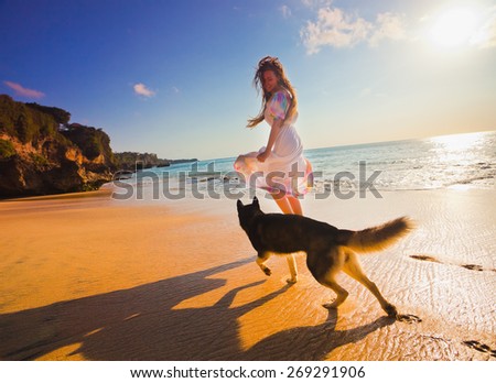 woman traveling with dog near the beach