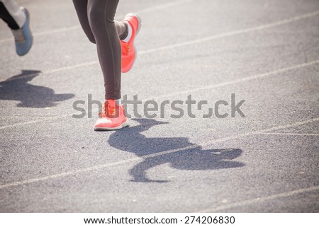 marathon of women feet jogging outdoor by the road with copy space for text