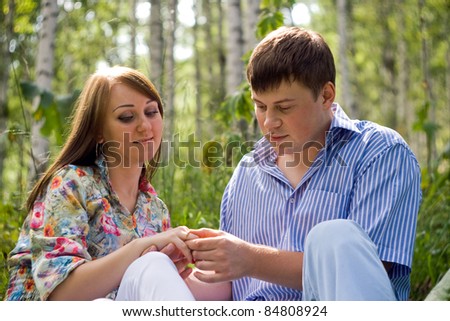 Portrait of happy love couple, first date in forest.