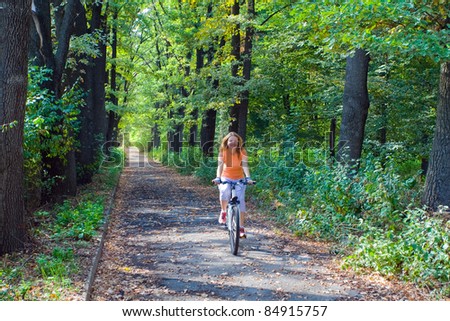 Activity image of young women travel by bicycle at sunset light in National Park