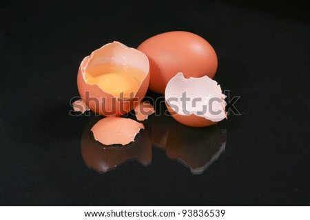 Egg and broken egg on the background