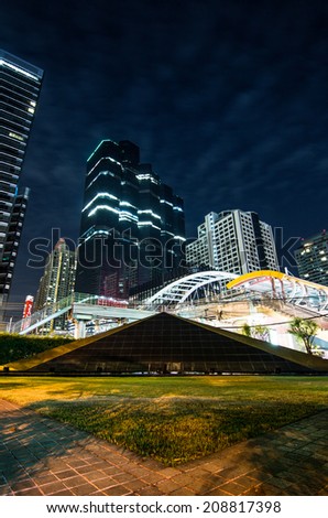 BANGKOK -August 2: high buildings and public sky walk for transit between Sky Transit and Bus Rapid Transit Systems at Sathorn-Narathiwas junction on August 2, 2014 in Bangkok, Thailand.