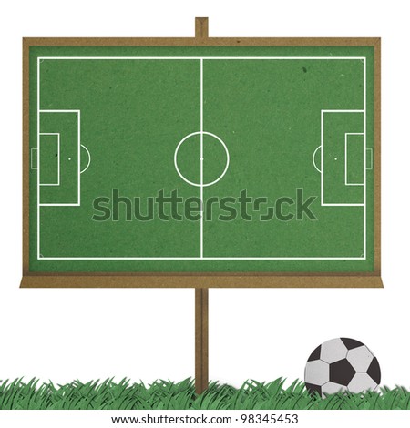 football field board and classic football stand on grass. made by grunge recycle paper.