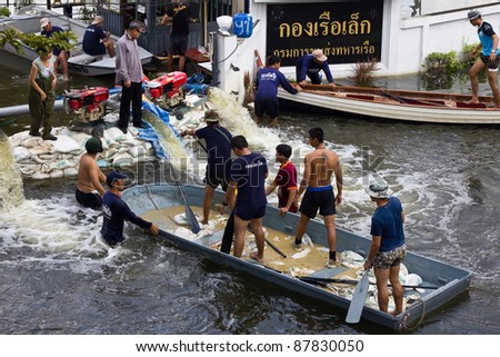 BANGKOK, THAILAND - OCTOBER 30 : The Royal Thai Navy helping  to drain the water out from the building on October 30,2011  Bangkok, Thailand.