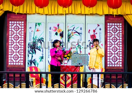 GUANGZHOU - FEB 20. Unidentified people Singing traditional Chinese songs on Celebration of the 2013 Chinese Lunar New Year on Feb. 20, 2013 in Guangzhou,Pray for the New Year good luck.