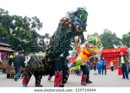 GUANGZHOU - FEB 20. Dance lion on Celebration of the 2013 Chinese Lunar New Year  on Feb. 20, 2013 in Guangzhou,Pray for the New Year good luck.