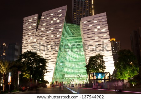 GUANGZHOU, CHINA - MAY.2: Guangzhou New library night landscape on May. 2, 2013 in Guangzhou, China. Designed by NIKKEN SEKKEI LTD and has become one of the seven new landmarks in Guangzhou