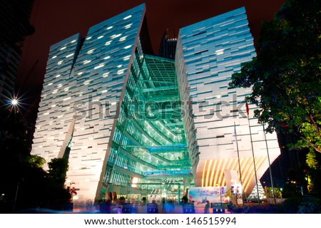 GUANGZHOU, CHINA - JUL.8: Guangzhou New library night landscape on Jul. 8, 2013 in Guangzhou, China. Designed by NIKKEN SEKKEI LTD and has become one of the seven new landmarks in Guangzhou