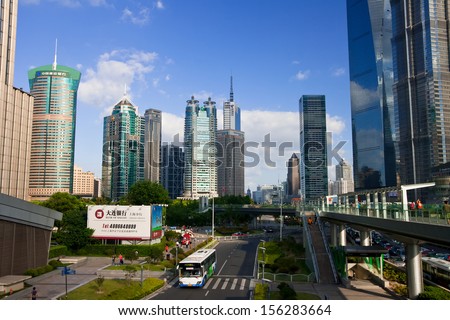 SHANGHAI, CHINA - SEP 17: Skyscrapers and street on Sep 17, 2013 in Shanghai. Shanghai is China\'s economic, financial, trade and shipping center