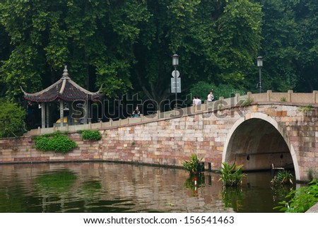 HANGZHOU, CHINA - SEP 15: Tourists in West Lake on Sep 15, 2013 in hangzhou, West lake is one of China\'s ten major places of historic interest and scenic beauty,world cultural heritage