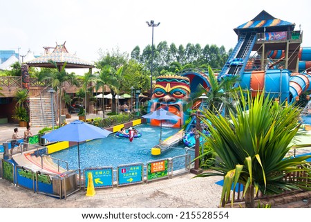 GUANGZHOU, CHINA - AUG 30: visitors in the chimelong water park on Aug 30, 2014 in Guangzhou. Chimelong Waterpark is the largest waterpark in the world.