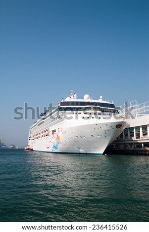 HONG KONG, CHINA - NOV 20: Big Cruise Ship berth at Victoria Harbor on Nov 20, 2014 in Hong Kong, Hongkong is a major tourist city in Asia,More than 40000000 visitors a year.
