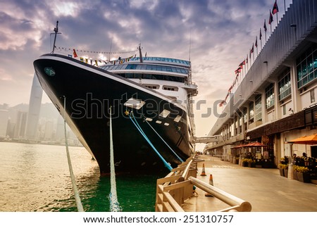 HONG KONG, CHINA - DEC 9: Big Cruise Ship berth at Victoria Harbor on December 9, 2013 in Hong Kong, China. Hongkong is a major tourist city in Asia,More than 40000000 visitors a year