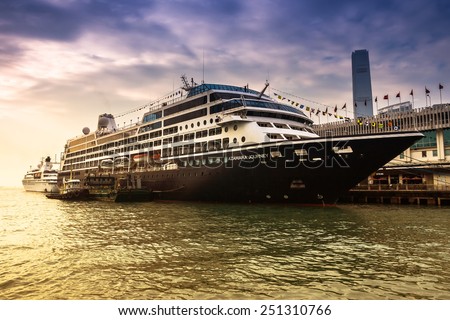 HONG KONG, CHINA - DEC 9: Big Cruise Ship berth at Victoria Harbor on December 9, 2013 in Hong Kong, China. Hongkong is a major tourist city in Asia,More than 40000000 visitors a year