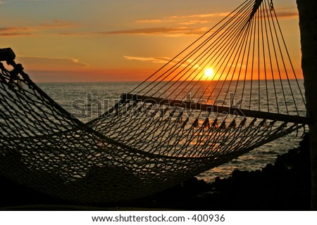 A sunset as seen through the netting of a hammock on the Big Island of Hawaii.