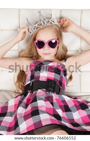 Picture of pretty young girl with pink glasses and princess crown