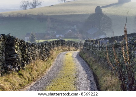 A track leading to a farm on a hazy day in the English Lake District