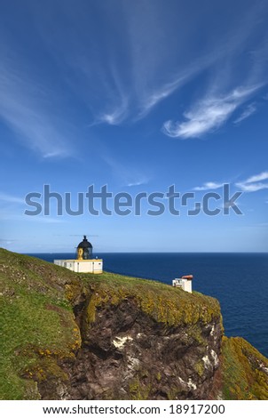 Pettico Wick is a beautiful inlet on Scotlands East Coast. The white lighthouse stands on the clifftop
