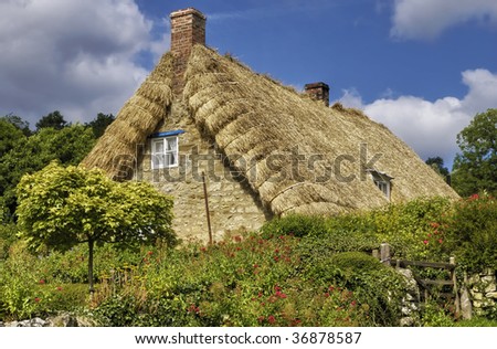 Exterior of traditional thatched cottage in countryside, Rievaulx village, North Yorkshire Moors National Park, England.