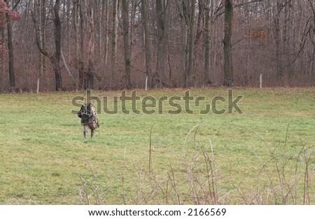Deer hunter on his way to the woods.