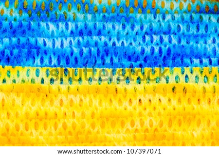 Very interesting blue and yellow wave pattern on perforated cloth.