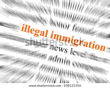 The text illegal immigration in focus. Surrounding text blurred with zoom effect.