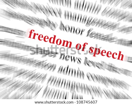 Freedom of speech text in red and in focus. Surrounding text out of focus with zoom effect.