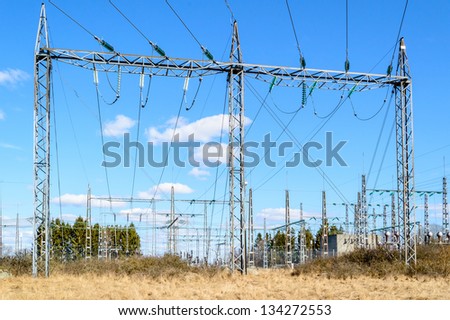 Power grid and transformation of electricity. Blue skies with white clouds.