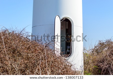 Wind power is the conversion of wind energy into a useful form of energy, such as using wind turbines to make electrical power. Here is a hatch for entering the tower to the turbine.