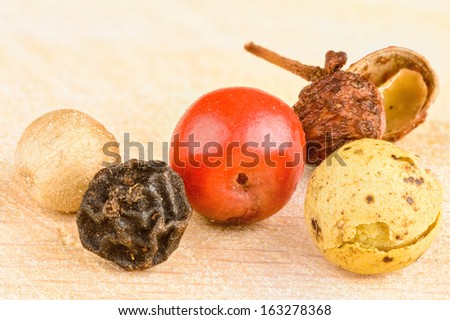Five peppercorns. White, black, pink, Sichuan and green from left to right