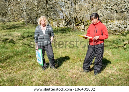 KALMAR, SWEDEN - APRIL 05, 2014: Two female nature guides educating on guide tour.