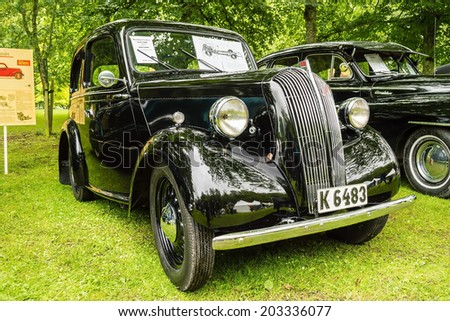 RONNEBY, SWEDEN - JUNE 28, 2014: Nostalgia Festival with classic cars and motorcycles as main attractions. Black Flying standard 1000 cc 2 doors sedan sunroof 1946.