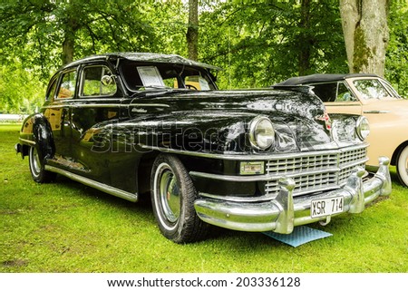 RONNEBY, SWEDEN - JUNE 28, 2014: Nostalgia Festival with classic cars and motorcycles as main attractions. Black Chrysler Windsor highlander 1948.