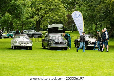 RONNEBY, SWEDEN - JUNE 28, 2014: Nostalgia Festival with classic cars and motorcycles as main attractions. Visitors looking at Borgward classic cars.