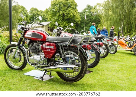 RONNEBY, SWEDEN - JUNE 28, 2014: Nostalgia Festival with classic cars and motorcycles as main attractions. BSA rocket 3, 750cc 1969 and more on display.