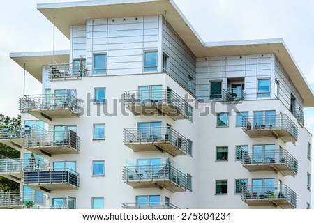 KARLSHAMN, SWEDEN - MAY 06, 2015: Top floors of modern high rise apartments with balconys in the centre of Karlshamn.