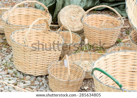 An assortment of handmade baskets on the ground.
