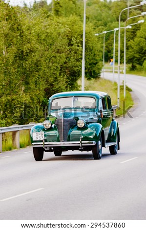RONNEBY, SWEDEN - JUNE 26, 2015: Veteran car street cruise on public roads. Chevrolet super deluxe 1939 green.