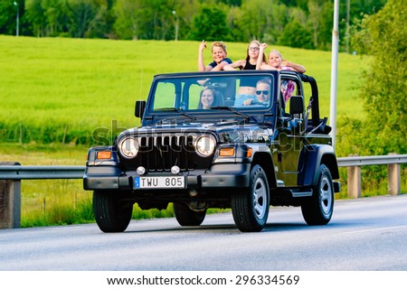 RONNEBY, SWEDEN - JUNE 26, 2015: Veteran car street cruise on public roads. Jeep wrangler 2002 black.