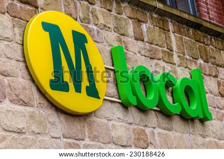 MACCLESFIELD,UK - NOVEMBER 12 2014: Morrisons Local supermarket  sign with logo.  Retail food prices are falling with all supermarkets including Morissons cutting their prices.