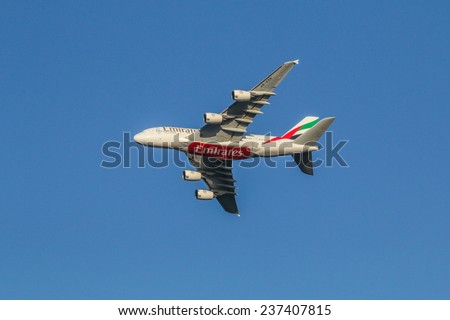 Manchester,UK - December 5th  2014: An An Emirates Airbus A380 - the worlds largest airliner - climbs away in a clear blue sky en-route to Dubai.
