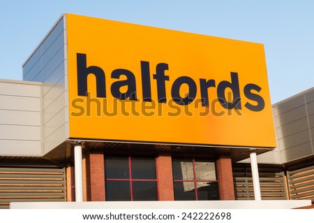 Manchester, UK - January 5th 2015: Halfords shop sign.  The independent motoring and leisure group is one of the Sunday Times 100 best smaller companies to work for 2014.