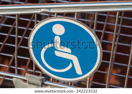 Wheelchair user disabled sign on a shopping cart /trolley extension for wheelchair users